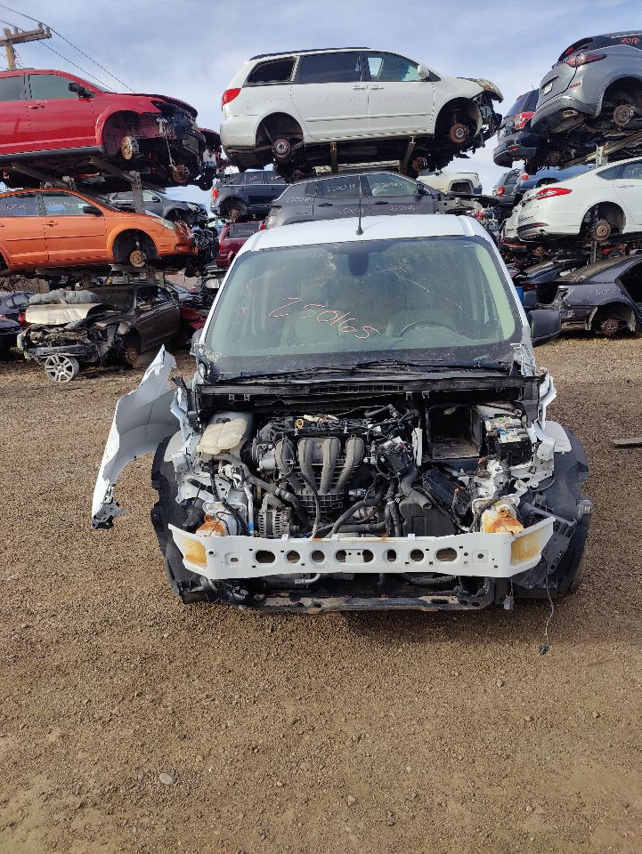 Front-end of a late-model vehicle stripped for tested OEM parts