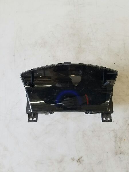 A recycled OEM instrument cluster pulled and tagged for resale